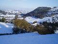 Snow setting over hills